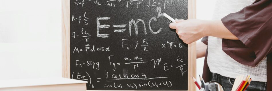 E-mc2 written on chalkboard