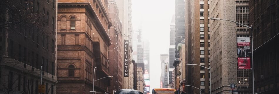 person walking on pedestrian lane between buildings