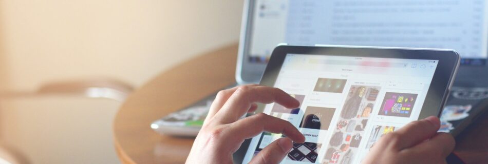 person holding black iPad