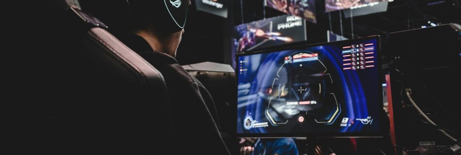 person sitting on gaming chair while playing video game