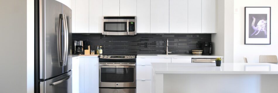 gray steel 3-door refrigerator near modular kitchen