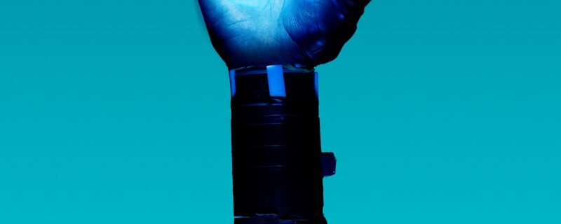 person holding blue light bulb