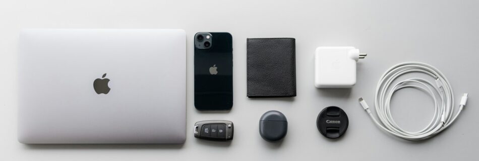 a white apple laptop sitting on top of a table